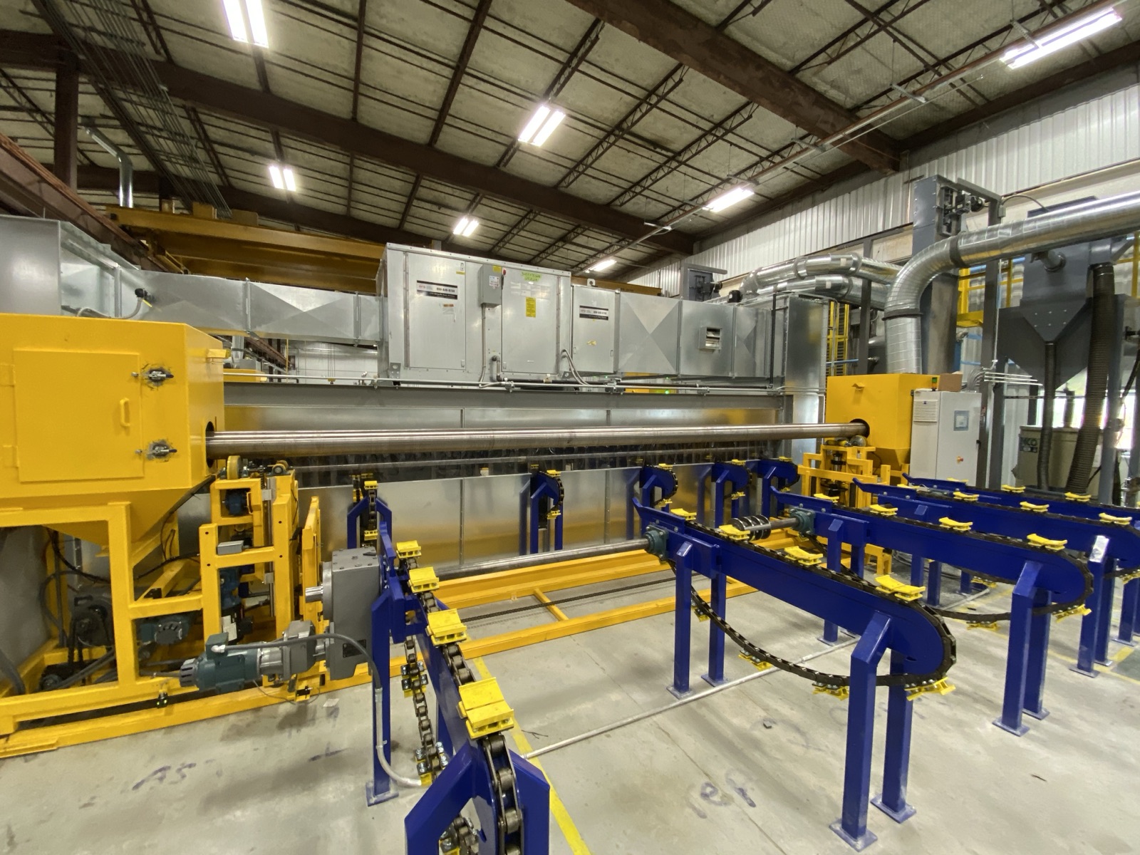 Enclosed processing line with a pipe on the entry conveyor